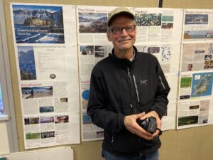 Bob Turner stands in front of the draft Marine Atlas